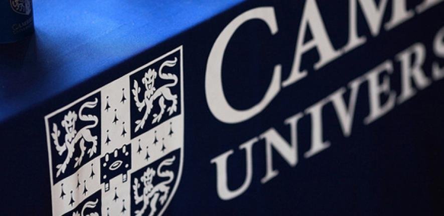Focus on the Cambridge City Campus logo on a tablecloth.
